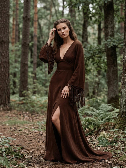 Chocolate brown goddess maxi dress with deep V neckline, open back and fringe macrame sleeves — handmade in Bali